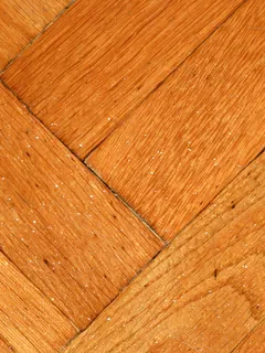 Textura detallada de un piso de madera antiguo con arañazos visibles